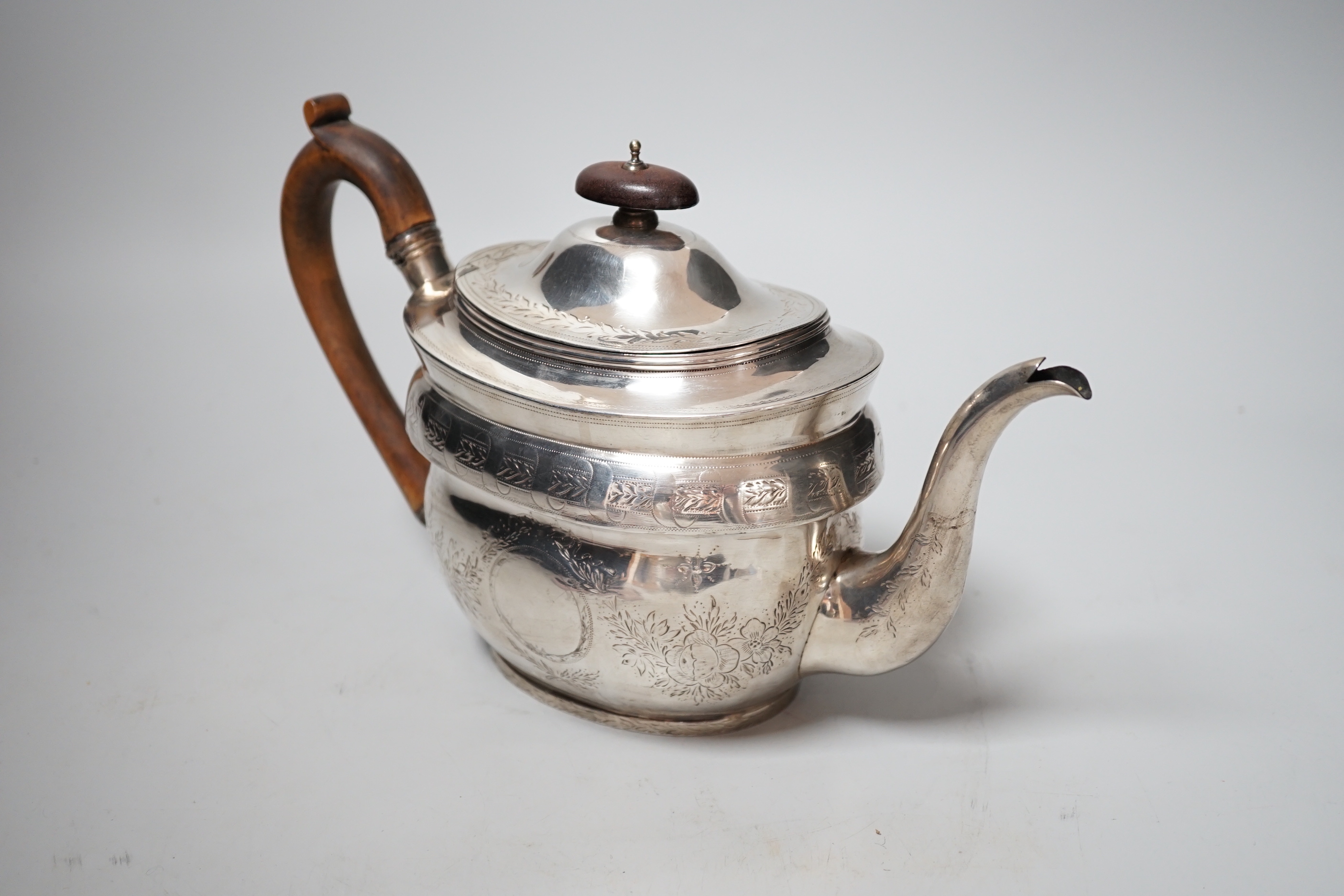 A George III engraved silver oval teapot, by Robert & Samuel Hennell, London, 1803, (repairs), gross weight 12.7oz.